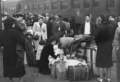 Japanese near trains during Relocation