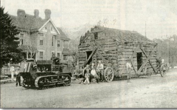 "Tractor and wagon moving cabin to Rees Pioneer<br />
Park"