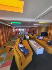 The lobby of the Americana dials all the themes of the googie exterior up to a maximum