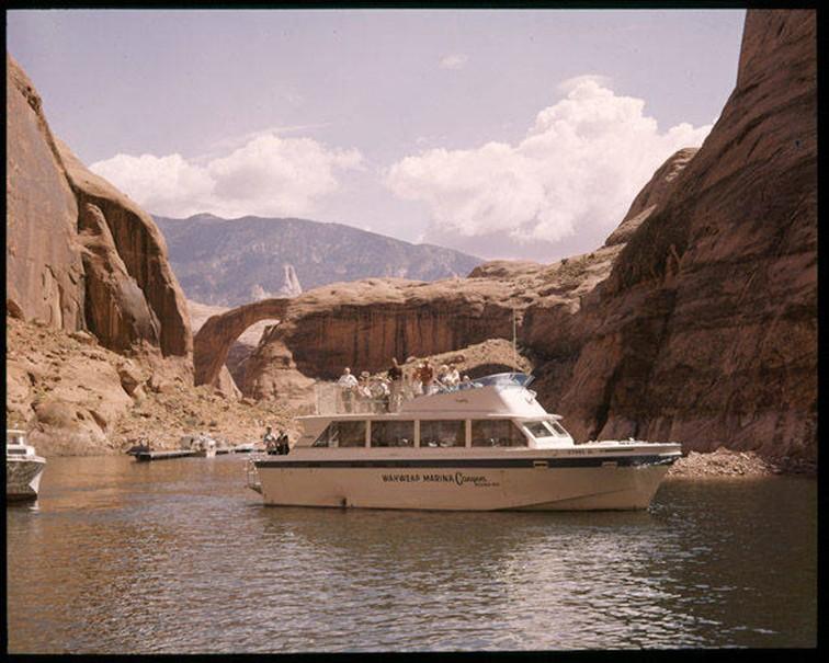 A sightseeing boat carrying tourists to the Rainbow Bridge marina, ca. 1960-1980