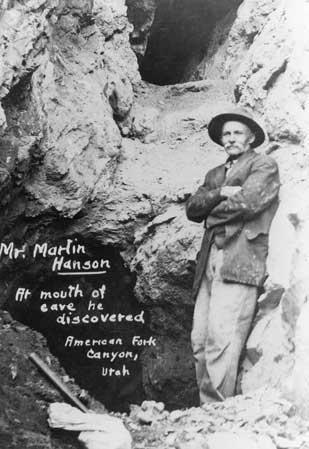 Martin Hansen stands at the natural entrance to Hansen Cave, which he discovered in 1887.