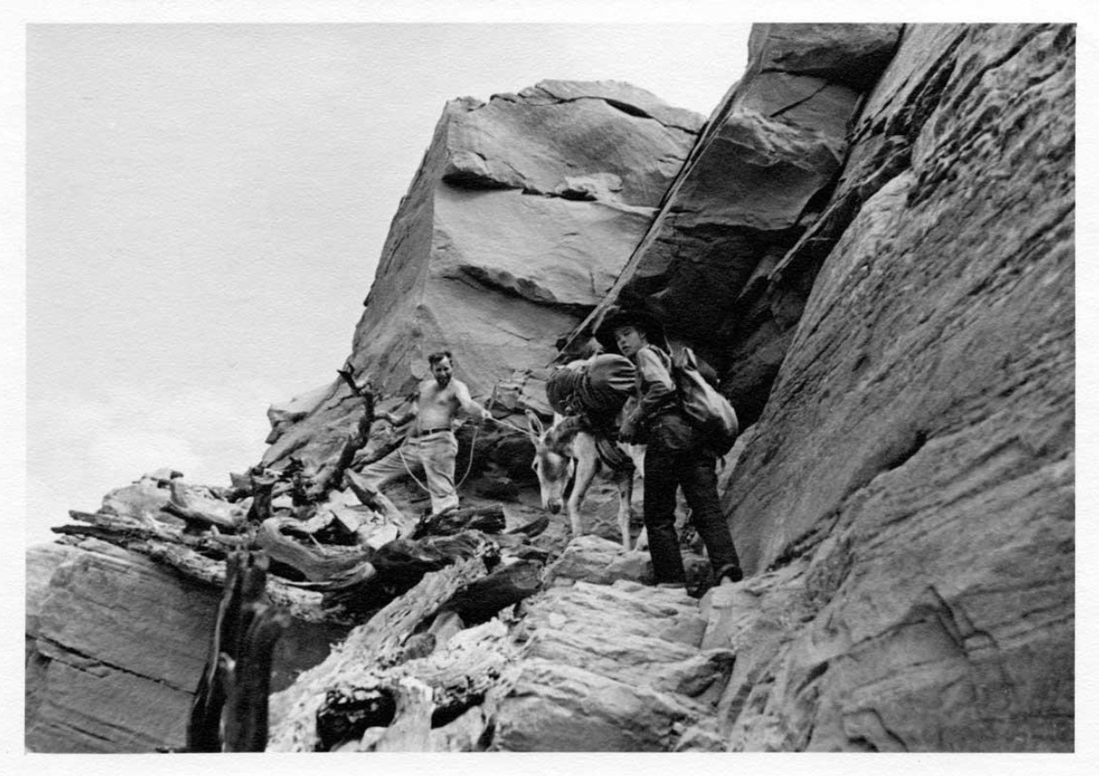 Everett Ruess and an unidentified shirtless man and burro. 1933
