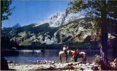 A motorboat departing from the east dock on Jenny Lake, postcard, ca. 1950s-1970s