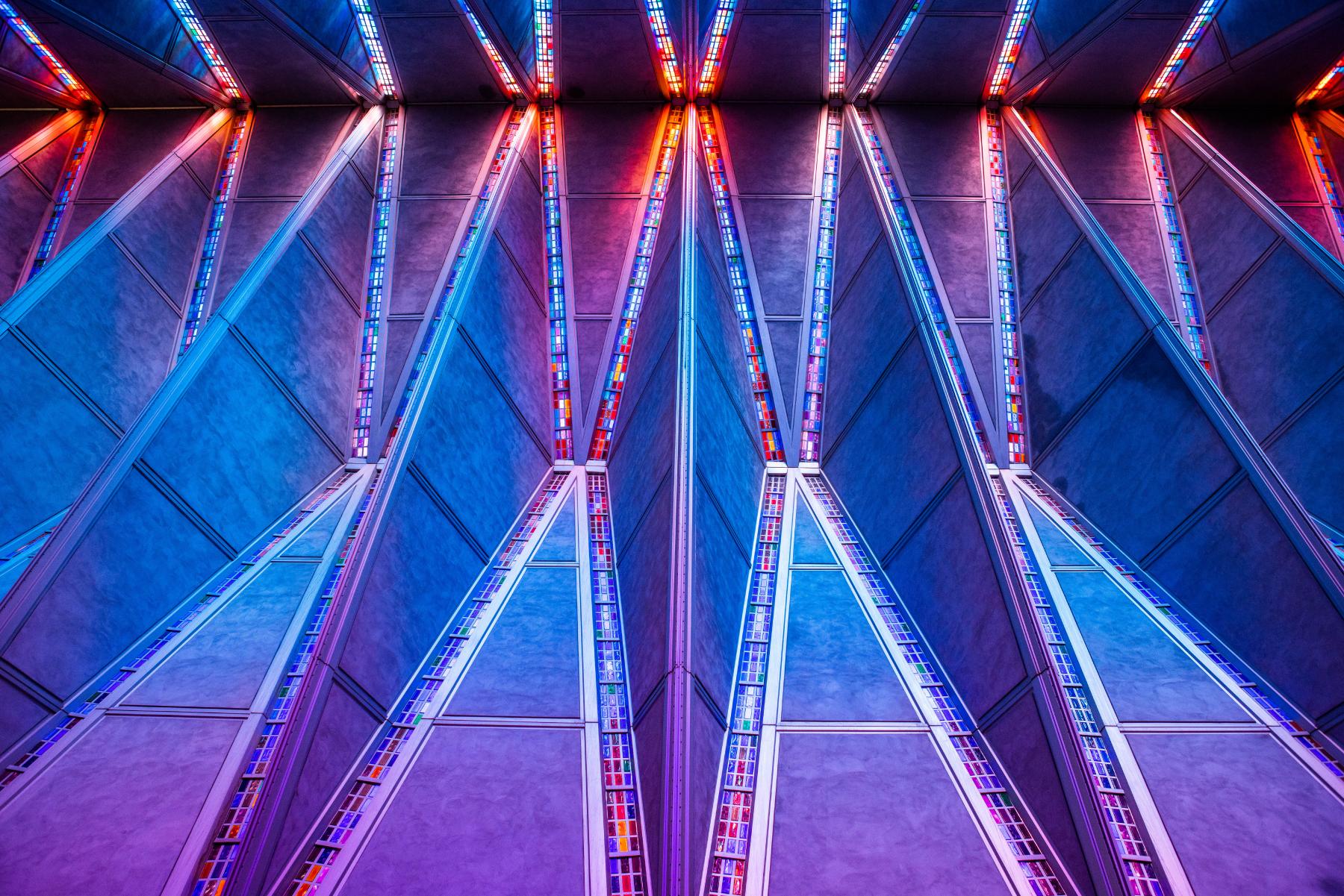 The multi-colored glass panels that run along the inside of the Academy Chapel bring an aspect of the divine into this ultra-modern space