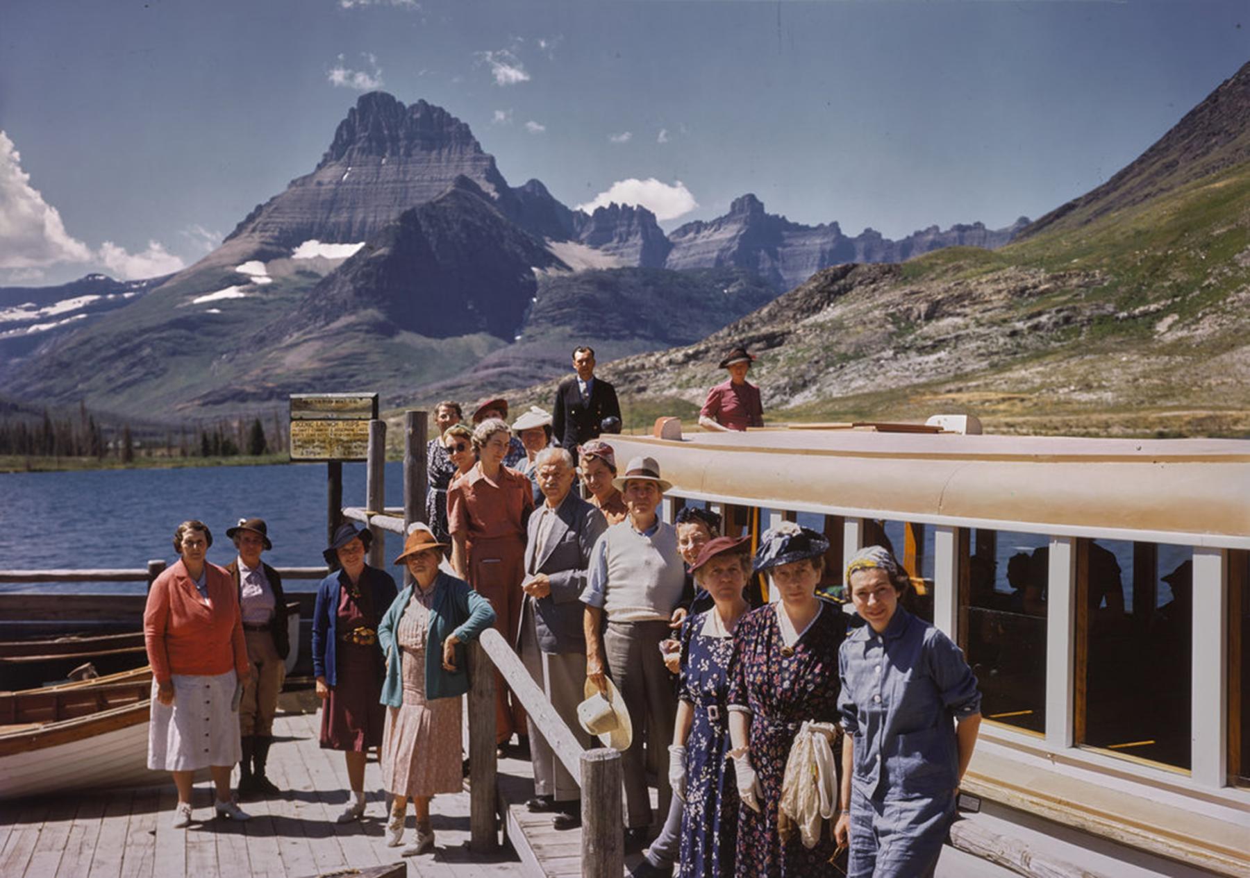 A group of tourists on a boat dock on Swiftcurrent Lake, ca. 1940-45