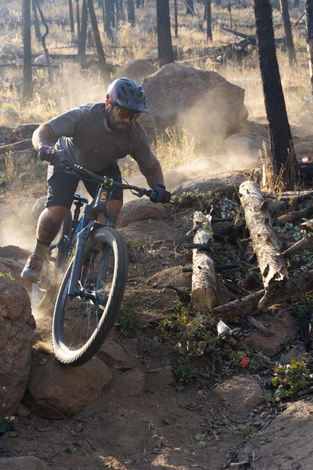 Rider descending Meteoride trail in dust