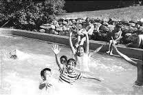 Children enjoy the swimming pool at St. Ann's Retreat in Logan Canyon