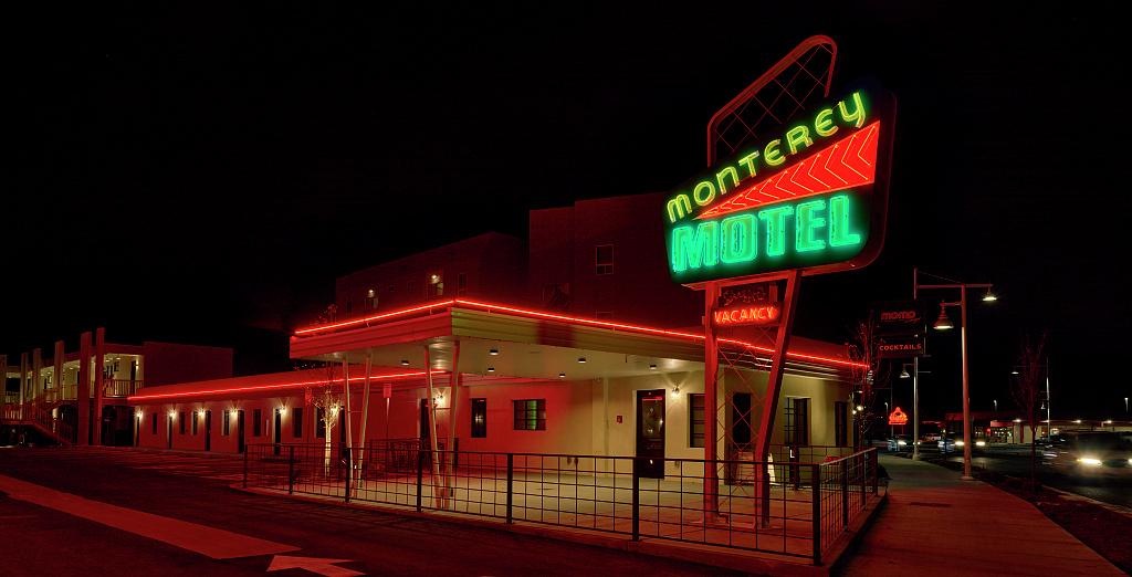 The stunning colors of the Monterey Motel at night seem to beckon the viewer in