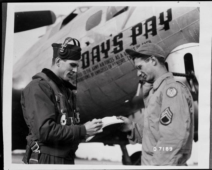 Day’s Pay pilot Arlys Wineinger, on the left, talks with the Ground Crew Chief Salvadore Leto